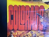 a poster for a movie starring a man with a gun