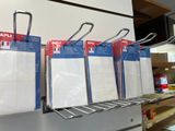 a lot of tags hanging on a rack in a store