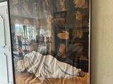 a picture of a man laying on a couch in a living room