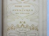 an open book with a picture of a crown on the cover