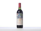 a bottle of wine that is sitting on a table