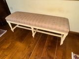 a bench that is sitting on the floor in a room