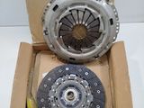 a box with a clutch and a clutch plate inside of it