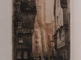 a black and white photo of a street with buildings
