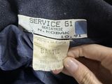 a picture of a person holding a label on a t - shirt