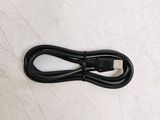 an image of a black cable connected to a laptop