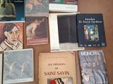 several books are sitting on a table next to each other