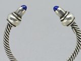 pair of silver and lapis beaded cuff bracelets with blue glass beads