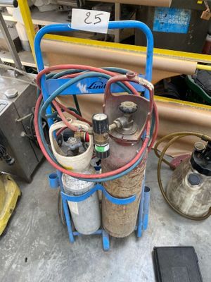 a cart with two cylinders and a hose on it
