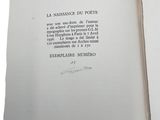 an open book with writing on it on a white surface