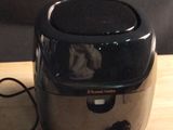 a toaster that is sitting on a wooden table