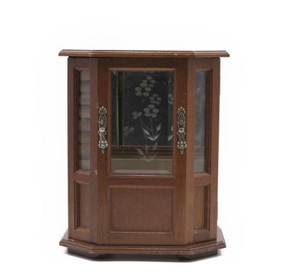 a small wooden corner cabinet with a glass door