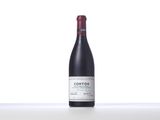 a bottle of red wine sitting on top of a table