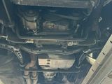 underside view of a car with a lot of rust on it