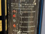 a bottle of wine that is sitting on a table