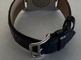 an image of a watch on a table with a price tag
