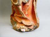une statue représentant un homme barbu et coiffé d'un chapeau