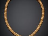 un collier en or et diamants, signé Cartier