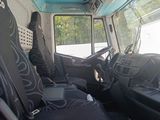 an image of the inside of a bus with the driver ' s seat up