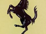 ferrari logo on a yellow frisbee with a black horse on it