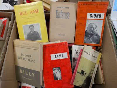 boxes of books are stacked on top of each other on a table