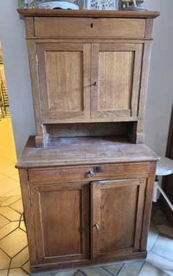 an old wooden cabinet in the corner of a room