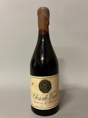 a bottle of wine that is sitting on a table
