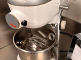 a mixer and a blender sitting on a kitchen counter
