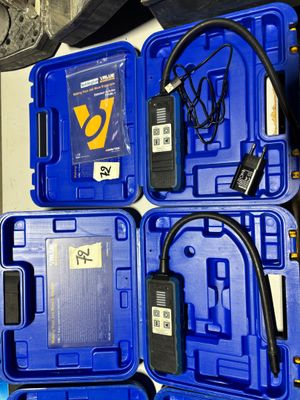 three blue plastic boxes with wires and wires attached to them