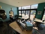 a room with a table, chairs, and a television in it