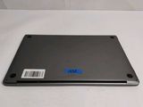 an open laptop computer sitting on top of a white table