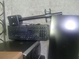 a keyboard and a mouse on a desk next to a monitor