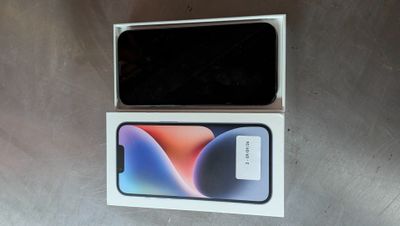 an open box with a phone inside of it sitting on a table