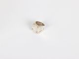a close up of a silver ring with a stone in the middle