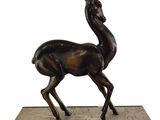 bronze statue of a gazelle on a marble base