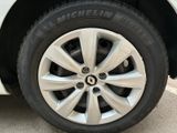 the tire of a white car with a black rim is shown