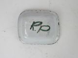 a white plate with the word r r on it
