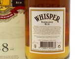 a bottle of whiskey sitting next to a box
