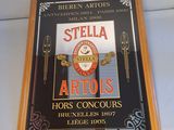 a sign on the wall that says stella artois