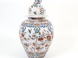 a large vase with a lid on a white background