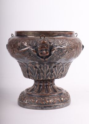 a silver vase with a bird on it on a white background