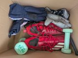 a box filled with shoes and a pair of tennis shoes