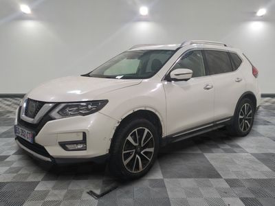the white nissan suv is parked on a checkered floor