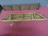 a wooden boat on a table with a pink table cloth