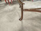 many chairs and tables in a room with cement flooring