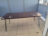 a table with speakers on it in a cubicle