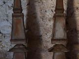 three different types of iron statues sitting on a table