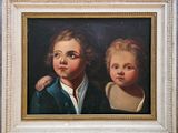 tableau représentant deux enfants, dans un cadre blanc sur fond noir