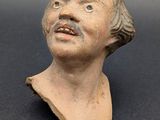 an image of a clay bust of a man