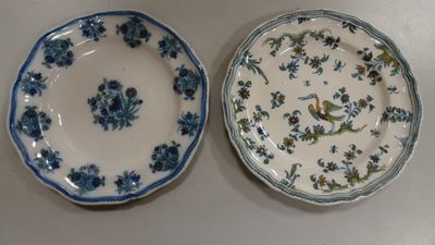two plates with blue and white designs on them
